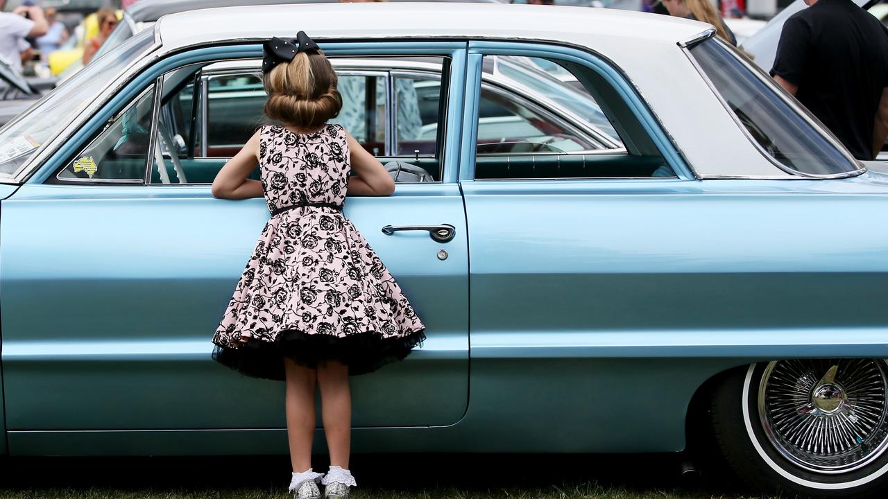 Liliana Jameson , 6, with a 1963 Chev Bel Air at CromeFest. Picture: Sue Graham