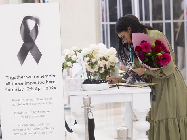 Tributes in April 2024 as shoppers returned to a Westfield shopping centre in Bondi Junction a week after 40-year-old Joel Cauchi stabbed and killed six people and wounded many others. Picture: NCA NewsWire / Jeremy Piper