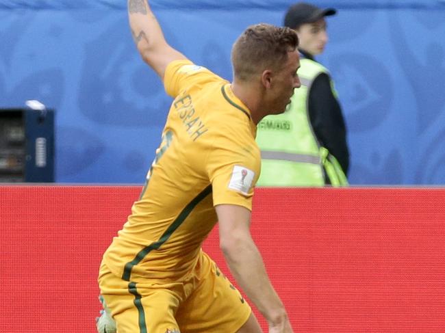 Australia's Alex Gersbach is fouled by Cameroon's Ernest Mabouka inside the penalty box during the Confederations Cup, Group B soccer match between Cameroon and Australia, at the St. Petersburg Stadium, Russia, Thursday, June 22, 2017. (AP Photo/Ivan Sekretarev)