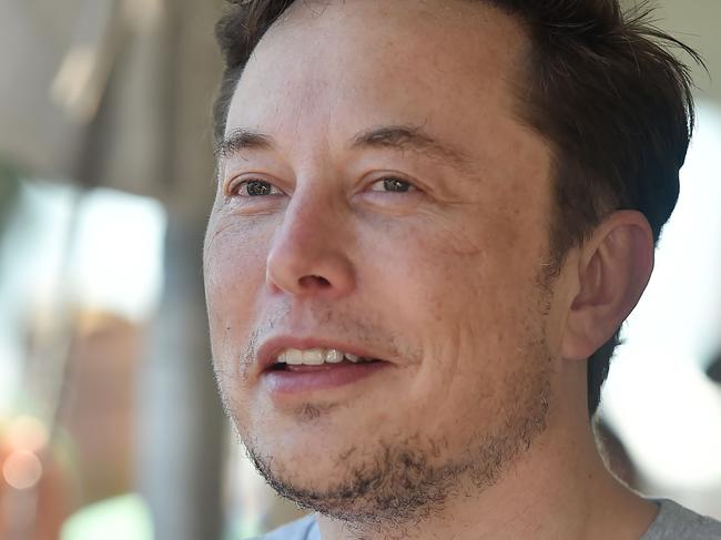 (FILES) In this file photo taken on July 22, 2018 SpaceX, Tesla and The Boring Company founder Elon Musk attends the 2018 SpaceX Hyperloop Pod Competition, in Hawthorne, California. - Tesla CEO Elon Musk said in a blog posting Friday, August 24, 2018, that his company would continue to be publicly traded, weeks after suggesting that he would take the electric carmaker private. Musk met with Tesla's board of directors on Thursday "and let them know that I believe the better path is for Tesla to remain public. The Board indicated that they agree," he wrote on the company blog. (Photo by Robyn Beck / AFP)