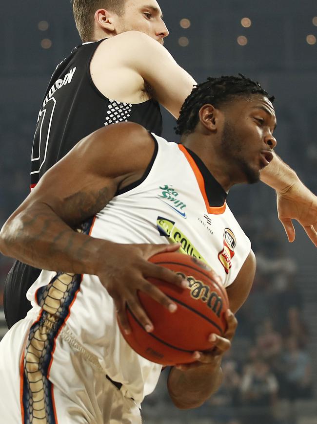 MELBOURNE, AUSTRALIA – FEBRUARY 13: Cameron Oliver of the Taipans rebounds the ball against Mitch McCarron of United during the round 20 NBL match between Melbourne United and the Cairns Taipans at Melbourne Arena on February 13, 2020 in Melbourne, Australia. (Photo by Daniel Pockett/Getty Images)