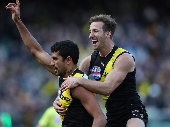 Kane Lambert jumps on Marlion Pickett after his goal. Picture: Michael Klein