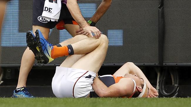 Jeremy Cameron in pain after colliding with the MCG fence.