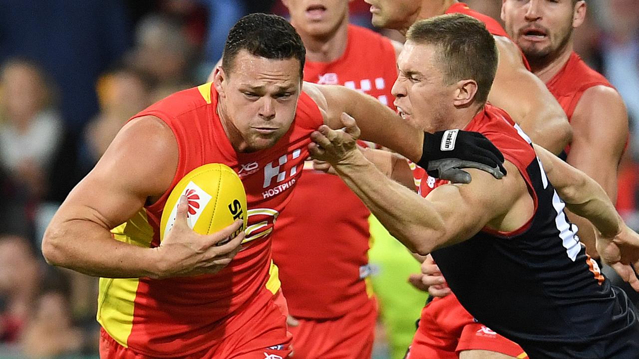 Steven May fends off Melbourne key forward Tom McDonald in 2018.