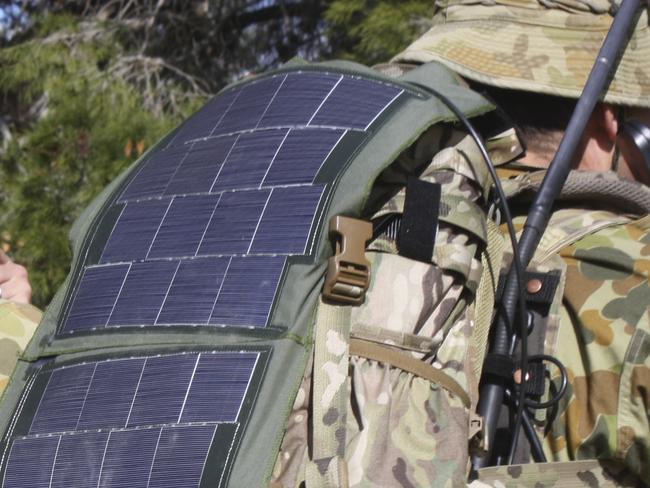 Australian soldiers wearing solar panels allowing them to recharge batteries..Pix ADF