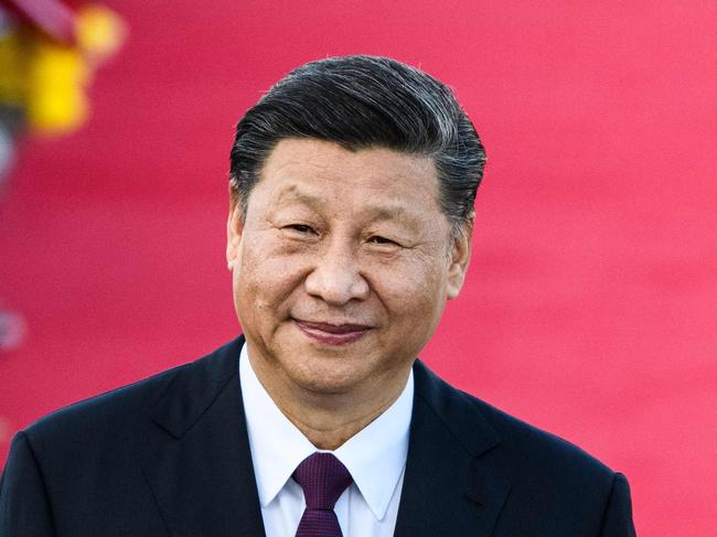 China's President Xi Jinping smiles before making a speech upon his arrival at Macau's international airport in Macau on December 18, 2019, ahead of celebrations for the 20th anniversary of the handover from Portugal to China. - Chinese president Xi Jinping landed in Macau on December 18 as the city prepares to mark 20 years since the former Portuguese colony was returned, a celebration that stands in stark contrast to months of unrest in neighbouring Hong Kong. (Photo by ANTHONY WALLACE / AFP)