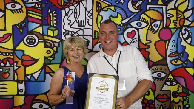 Leanne Brosnan and artist Travis Vinson celebrate the Thallon silo mural's big win at the Australian Street Art Awards.