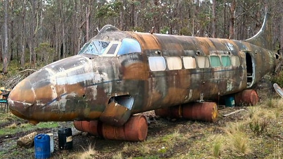 The fuselage of Heron VH-CLT now serves as a storage shed in the hills west of Woodbury, Tasmania. Photo: Gerard Brereton