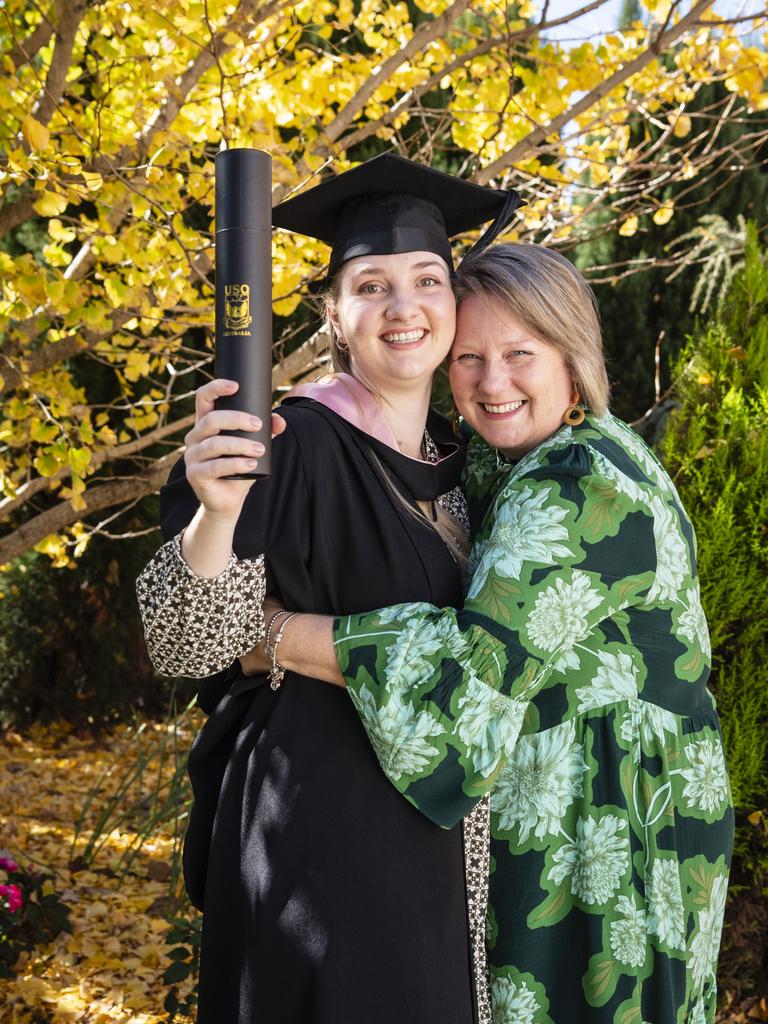 Bachelor of Education (Primary) graduate Courtney Sippel is congratulated by mum Debbie Walker at UniSQ graduation ceremony at Empire Theatres, Tuesday, June 27, 2023. Picture: Kevin Farmer