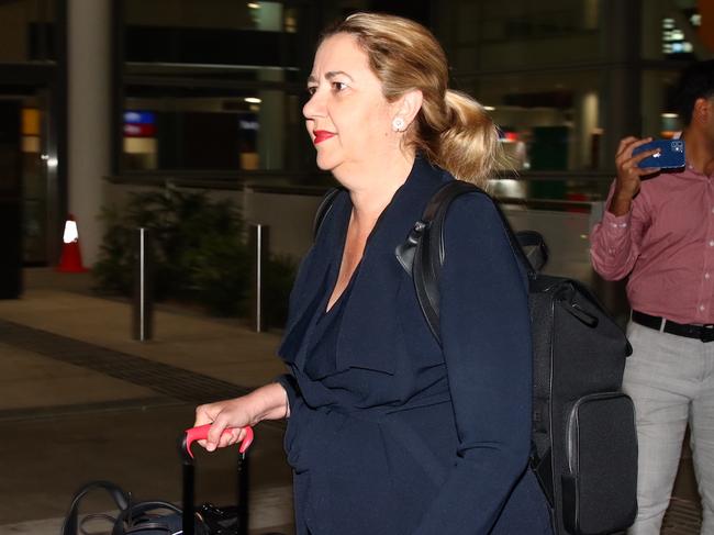 Premier Annastacia Palaszczuk arrives at Brisbane Airport late on Sunday night. Picture: David Clark