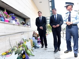 Mike Baird (C) has described the killing of police accountant Curtis Cheng as a tragic loss of life.