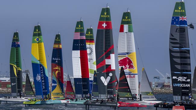 New Zealand SailGP Team helmed by Peter Burling lead Red Bull Italy SailGP Team helmed by Ruggero Tita and the rest of the SailGP fleet on Race Day 1 of the Rolex Los Angeles Sail Grand Prix held in the Port of Los Angeles, California, USA. Saturday 15 March 2025. Rolex SailGP Championship Event 4 Season 2025. Photo: Jason Ludlow for SailGP. Handout image supplied by SailGP