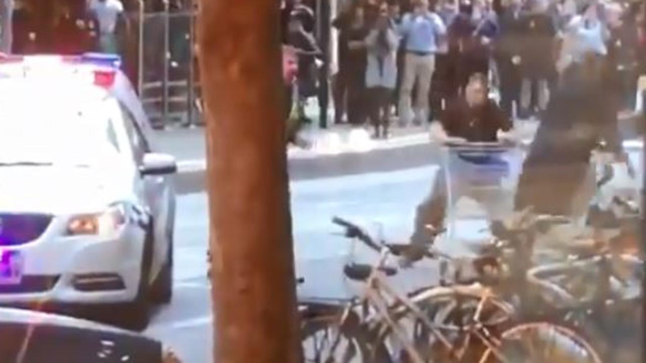 A man can be seen pushing a trolley towards the victim to try and stop the attack. Picture: Twitter