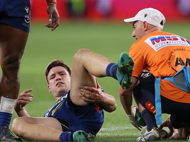 SYDNEY, AUSTRALIA - SEPTEMBER 16:  Tom Opacic of the Eels is attended to by the team trainer after an injury during the NRL Semi Final match between the Parramatta Eels and the Canberra Raiders at CommBank Stadium on September 16, 2022 in Sydney, Australia. (Photo by Mark Kolbe/Getty Images)