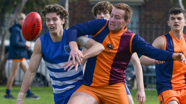 St Peter’s player Morgan Ferres and St Michael’s Oscar McCann battle for the ball during the round five college football clash on Saturday. Picture: Brenton Edwards