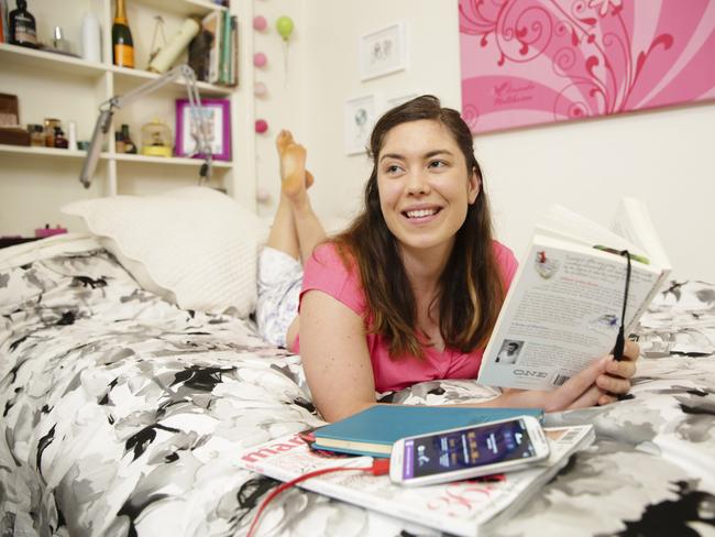 Gretel Maltabarow in her bedroom using the new cancer research app on her phone Picture: Justin Lloyd