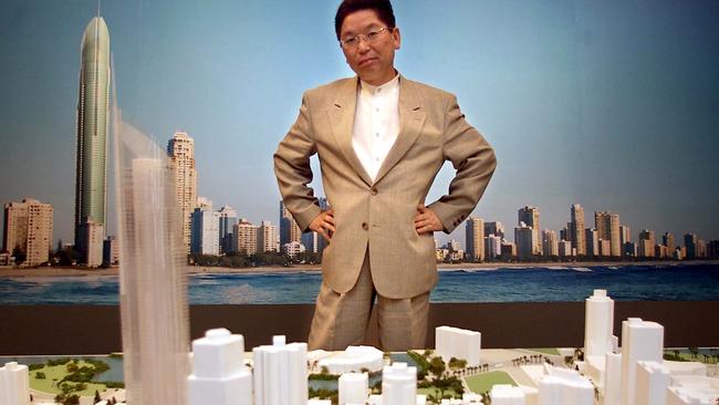 Buyer Akeo Kakemoto checking out his new $8.9 Million apartment's on a model of the Q1 in 2002.