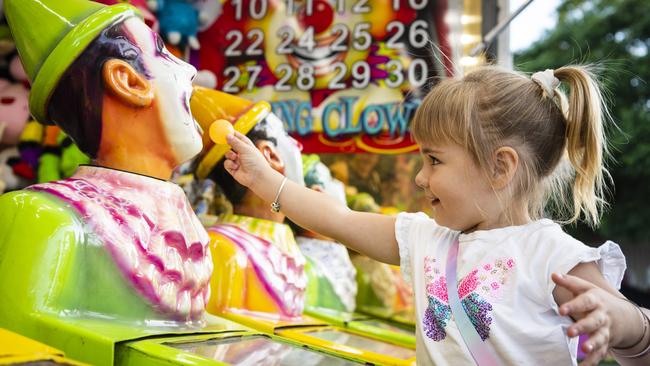 Ruby-Jane Hopper, 3, plays in sideshow alley at the Toowoomba Royal Show, Thursday, March 30, 2023. Picture: Kevin Farmer