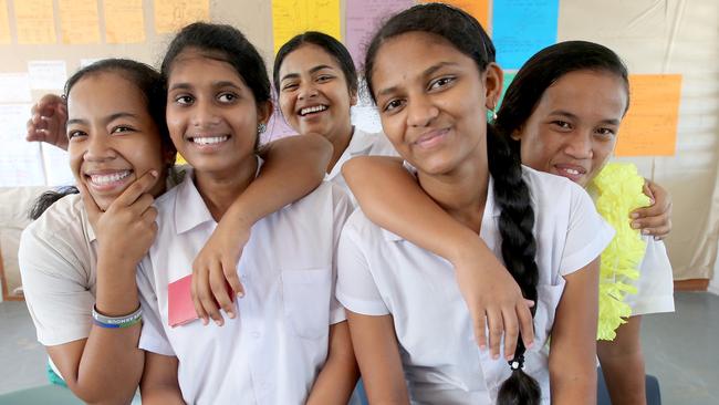 Refugee students Suki and Shana, centre, with Nauruan classmates Kalista Seymour, Myrose Joram and Luckina Dagagio. Picture: Nathan Edwards