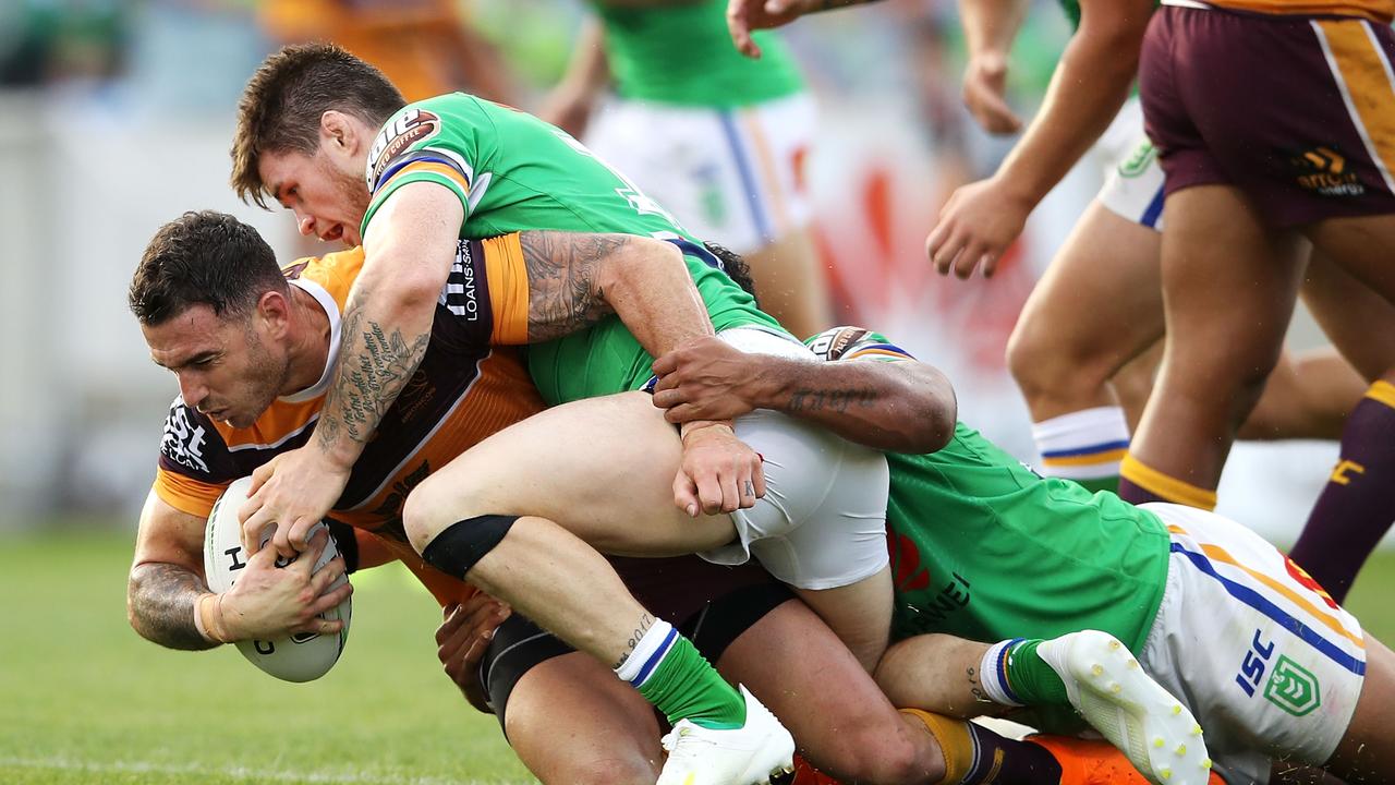 CANBERRA, AUSTRALIA - APRIL 21: Darius Boyd of the Broncos is tackled during the round 6 NRL match between the Canberra Raiders and the Brisbane Broncos at GIO Stadium on April 21, 2019 in Canberra, Australia. (Photo by Mark Kolbe/Getty Images)