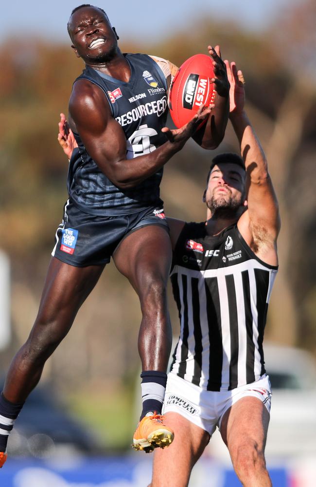 Irra Emmanuel of South marks over Jimmy Toumpas of Port at Noarlunga. Picture: Matt Turner