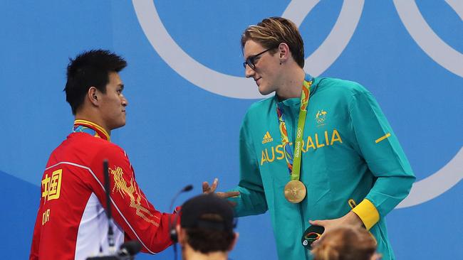 Australia's Mack Horton shakes hands (awkwardly) with Sun Yang. Picture: Phil Hillyard