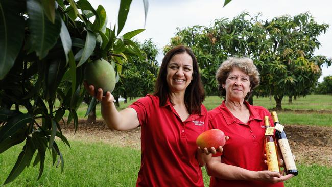 The increase in tourism numbers to Cairns has also seen an increase in tourists looking to add authentic rural and regional experiences to their Far North Queensland holiday. Golden Drop Winery director Maria Nastasi and cellar door manager Grace Parker have seen more tourists visiting their Biboohra orchard and sampling the mango wine and liqueurs on sale. Picture: Brendan Radke