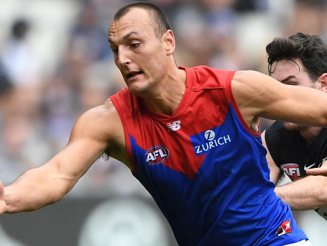 Braydon Preuss of the Demons (left) and Mitch McGovern of the Blues contest during the Round 16 AFL match between the Carlton Blues and the Melbourne Demons at the MCG in Melbourne, Sunday, July 7, 2019. (AAP Image/Julian Smith) NO ARCHIVING, EDITORIAL USE ONLY