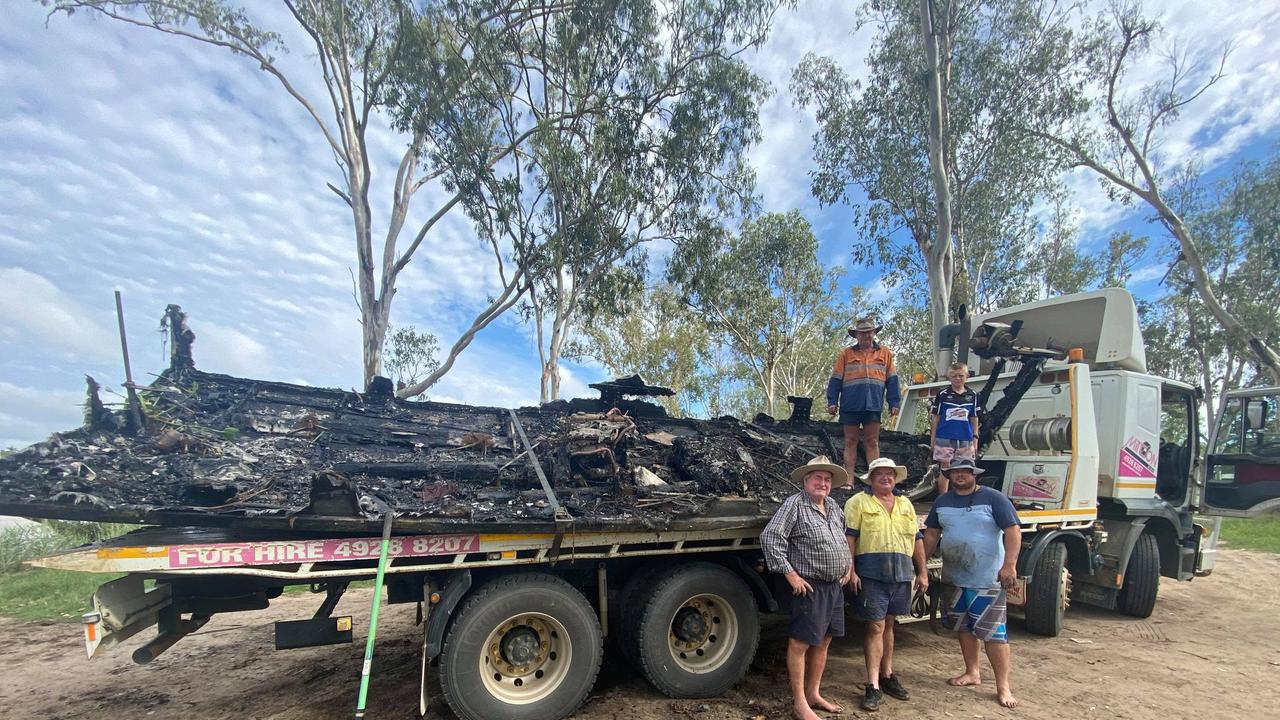 The remains of Mark Prosser's boat Old Dun as it was towed from the river.