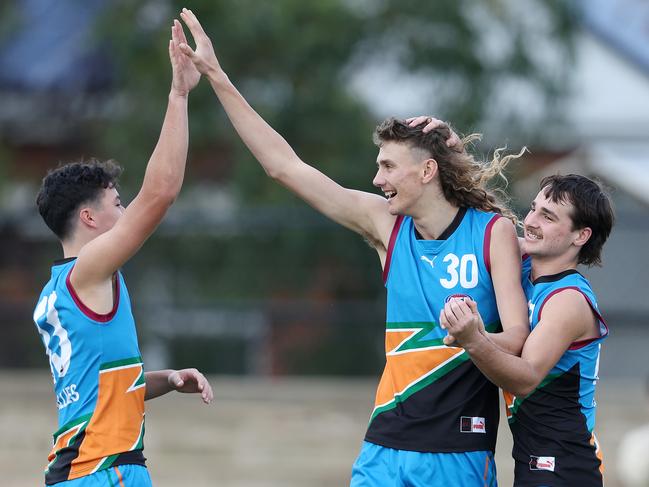 ADELAIDE, AUSTRALIA - JUNE 11: Charlie McCormack of the Allies celebrates his goal with Jack Callinan of the Allies  and William Rowlands of the Allies. during the 2023 U18 Championships match between Allies and Western Australia at Thebarton Oval on June 11, 2023 in Adelaide, Australia. (Photo by Sarah Reed/AFL Photos via Getty Images)