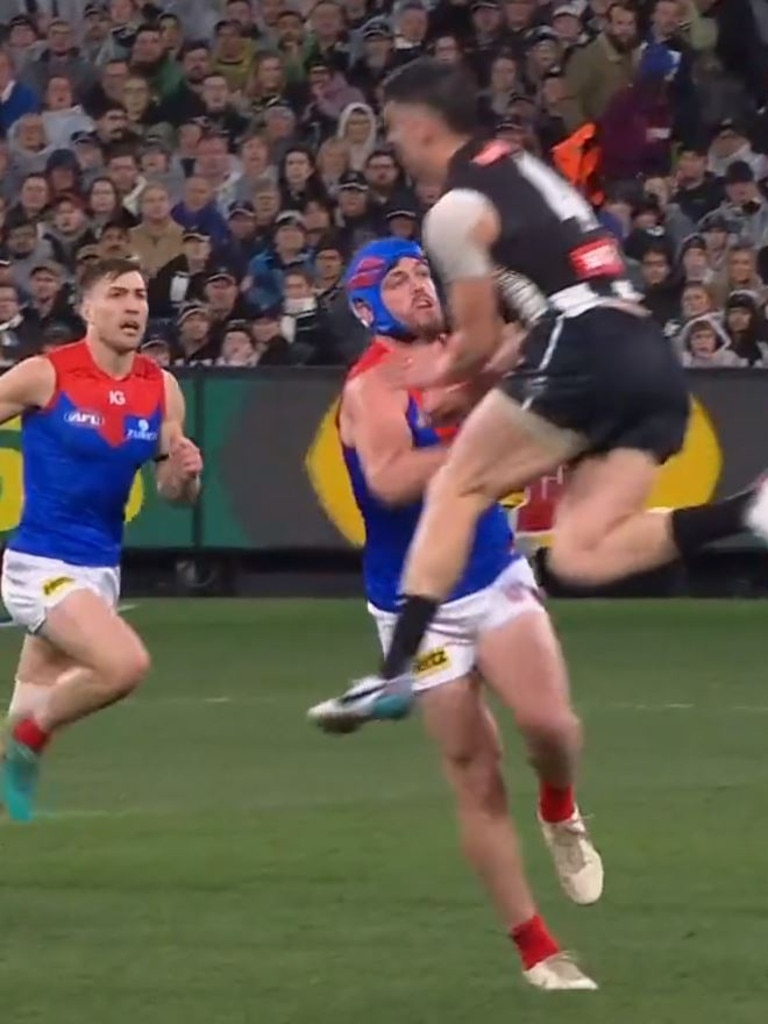 Angus Brayshaw of the Demons is cleaned up by Brayden Maynard. Pic: Fox Sports