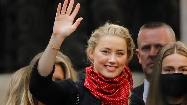 US actress Amber Heard waves as she leaves on the fifth day of the libel trial. Picture: Tolga Akmen/AFP