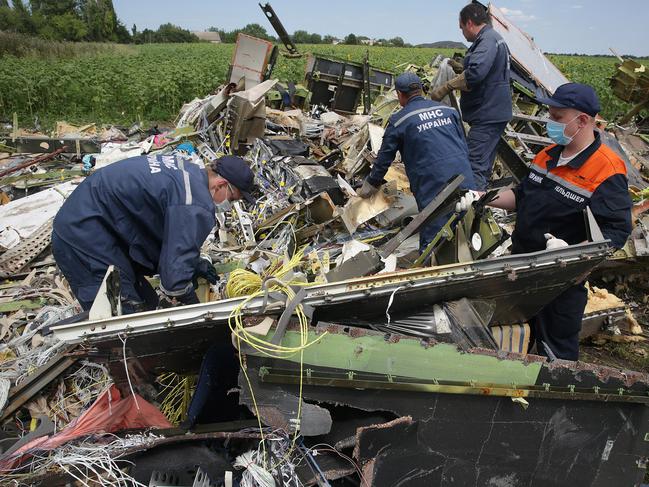 Workers at the site of the MH17 crash. Picture: Ella Pellegrini