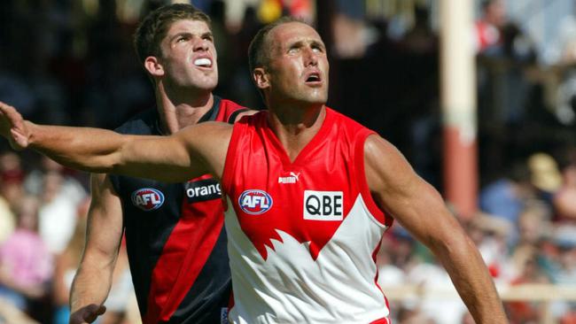 Tony Lockett matches up on Sam Hunt during a 2002 pre-season game. Picture: Phil Hillyard