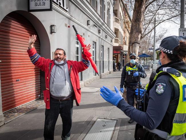 Anti-lockdown / anti-mask protesters attempt to protest at State Parliament. A man is arrested after removing his mask and yelling anti-vaccination chants. Picture: Jake Nowakowski