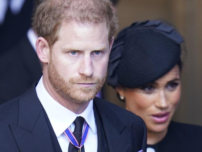 LONDON, ENGLAND - SEPTEMBER 14: Prince Harry and Meghan, Duchess of Sussex leave Westminster Hall, London after the coffin of Queen Elizabeth II was brought to the hall to lie in state ahead of her funeral on Monday on September 14, 2022 in London, England. Queen Elizabeth II's coffin is taken in procession on a Gun Carriage of The King's Troop Royal Horse Artillery from Buckingham Palace to Westminster Hall where she will lay in state until the early morning of her funeral. Queen Elizabeth II died at Balmoral Castle in Scotland on September 8, 2022, and is succeeded by her eldest son, King Charles III. (Photo Danny Lawson - WPA Pool/Getty Images)