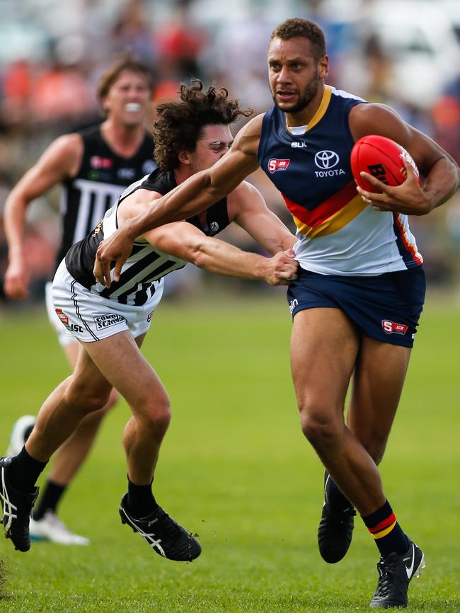 Darcy Byrne-Jones of Port tackles Cameron Ellis-Yolmen of the Crows during the 2016 SANFL season. Both are now AFL regulars. Picture: Matt Turner.