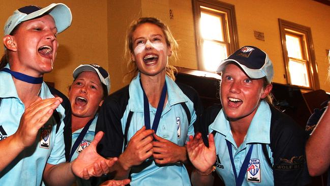 The victorious NSW team sing their song in the rooms in 2009. Picture: Phil Hillyard