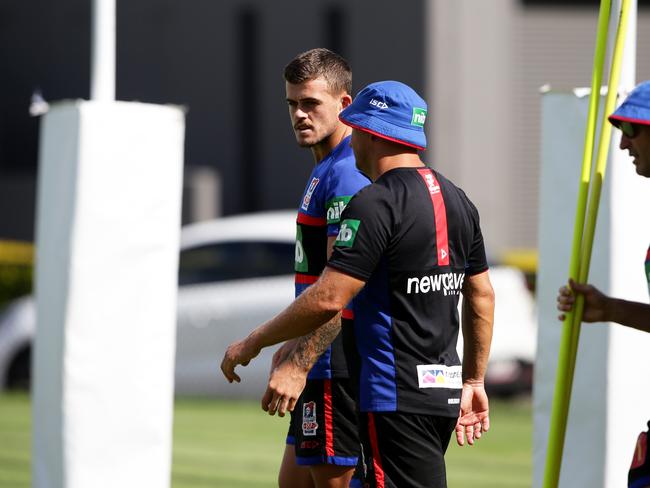 Newcastle rookie Dylan Phythian talks to coach Nathan Brown at training on Wednesday Picture: Peter Lorimer.