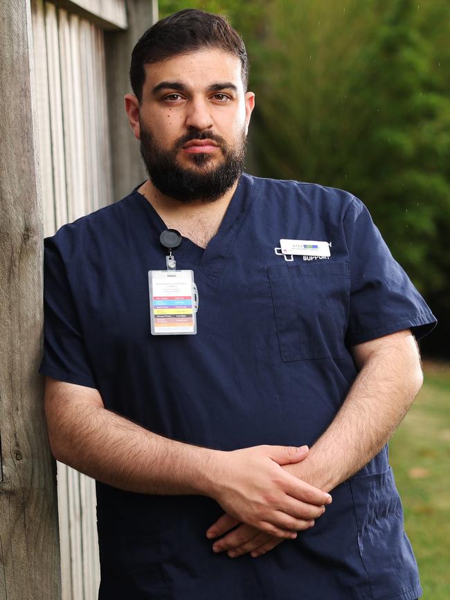 Nurse Ezra says he has been rejected by patients and spat at while at work, and now covers up his surname. Picture: Rohan Kelly