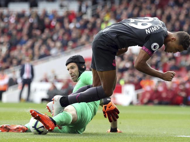 Arsenal goalkeeper Petr Cech, left, tackles Everton's Dominic Calvert-Lewin during the English Premier League soccer match at the Emirates Stadium, Sunday Sept. 23, 2018. (Nick Potts/PA via AP)