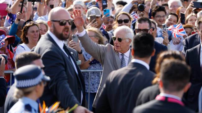 King Charles waves to the crowd at the Sydney Opera House as he and Queen Camilla round off their royal tour. Picture: NewsWire / Damian Shaw