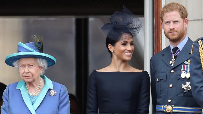 LONDON, ENGLAND - JULY 10: Queen Elizabeth II, Prince Harry, Duke of Sussex and Meghan, Duchess of Sussex on the balcony of Buckingham Palace as the Royal family attend events to mark the Centenary of the RAF on July 10, 2018 in London, England. (Photo by Chris Jackson/Getty Images)