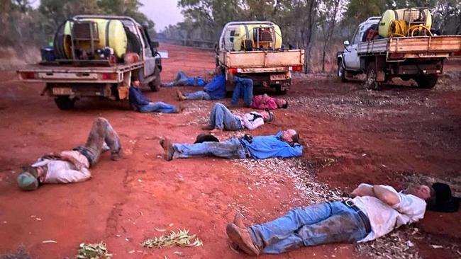 Exhausted Prairie Rural Fire Brigade crews working at Rellum and Springhill taking a breather on November 8. Picture: Tom Duddy-Supplied