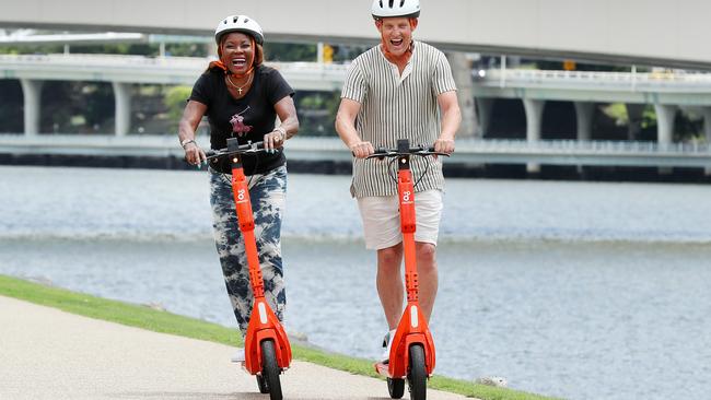 Look out ...Marcia Hines and Todd McKenney are scooter-crazy, so don’t be surprised if you see them roaring along the boardwalk outside QPAC where they are starring in Shrek the Musical. Picture: Liam Kidston