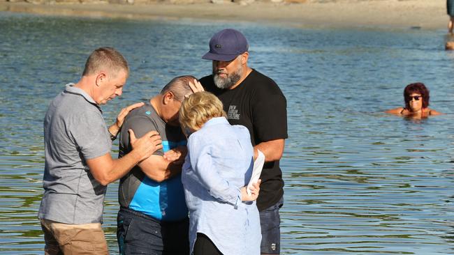 The baptism in the lake. Picture Mike Batterham.