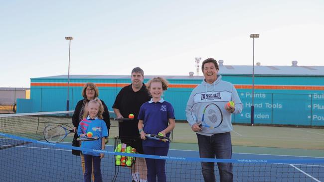 Sheryle Windle, Maggie Stevens, Nathan Costello, Charlotte Stevens and Marco Gliori celebrate Warwick and District Tennis Association's grant.