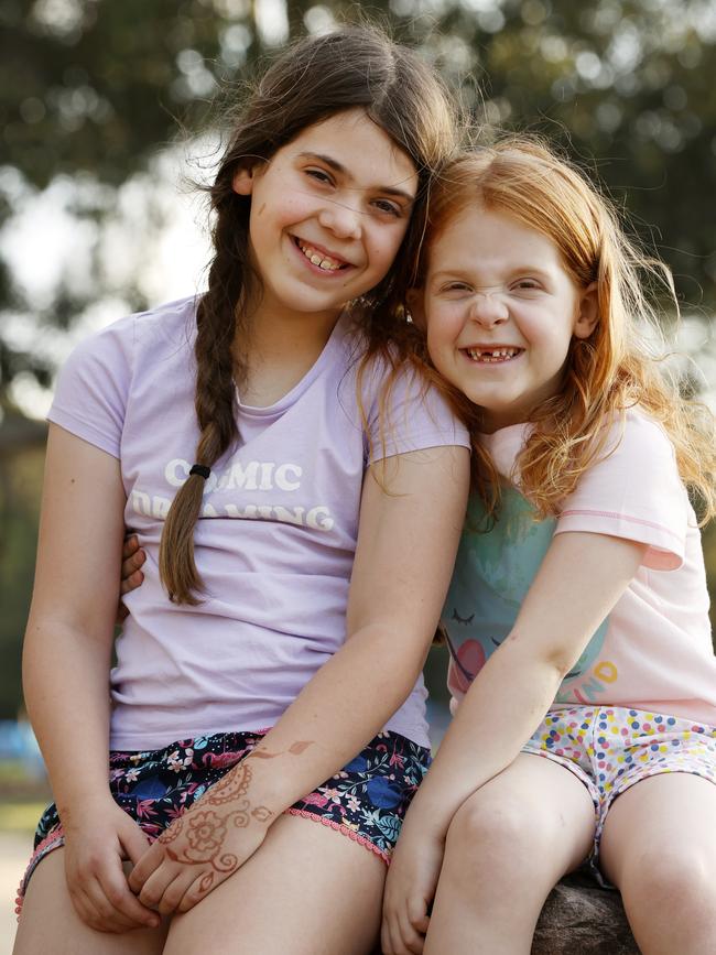 Millie, 9, and her sister Celia, 6, have missed social interaction. Picture: Jonathan Ng