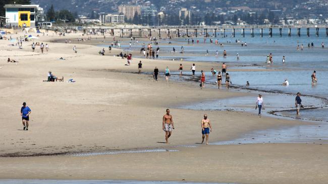 Social Distancing at the beach. Looking south from Grange towards Henley, for the most part, although there were a lot of people along the coast, most seemed to be trying to do the right thing, by maintaining a safe distance between one another. 28 March 2020. (AAP Image/Dean Martin)