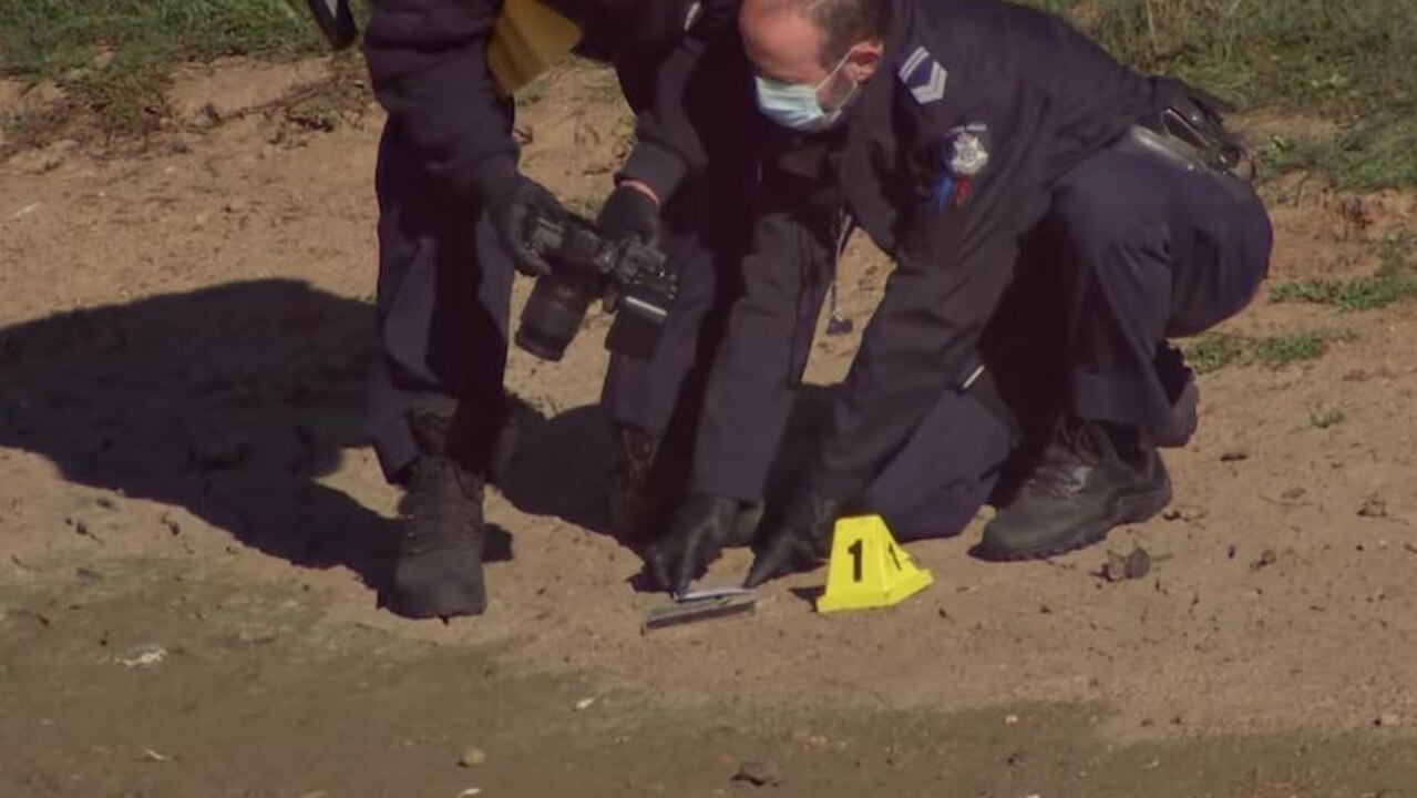 Police photograph a phone. Picture: Supplied / ABC